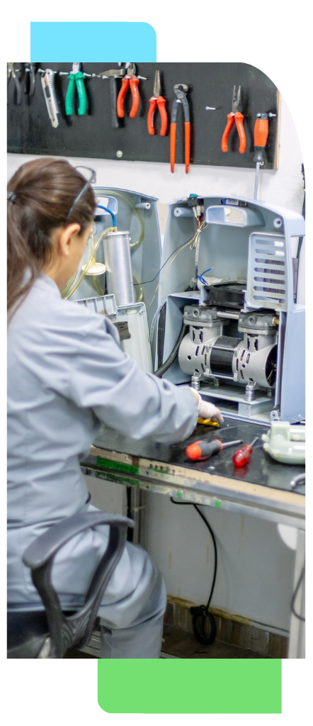 Skilled manufacturing worker assembling industrial machinery in a production workspace.
