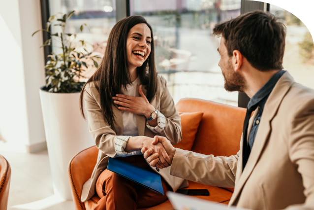 Employee collaborating with colleagues in a modern workplace.