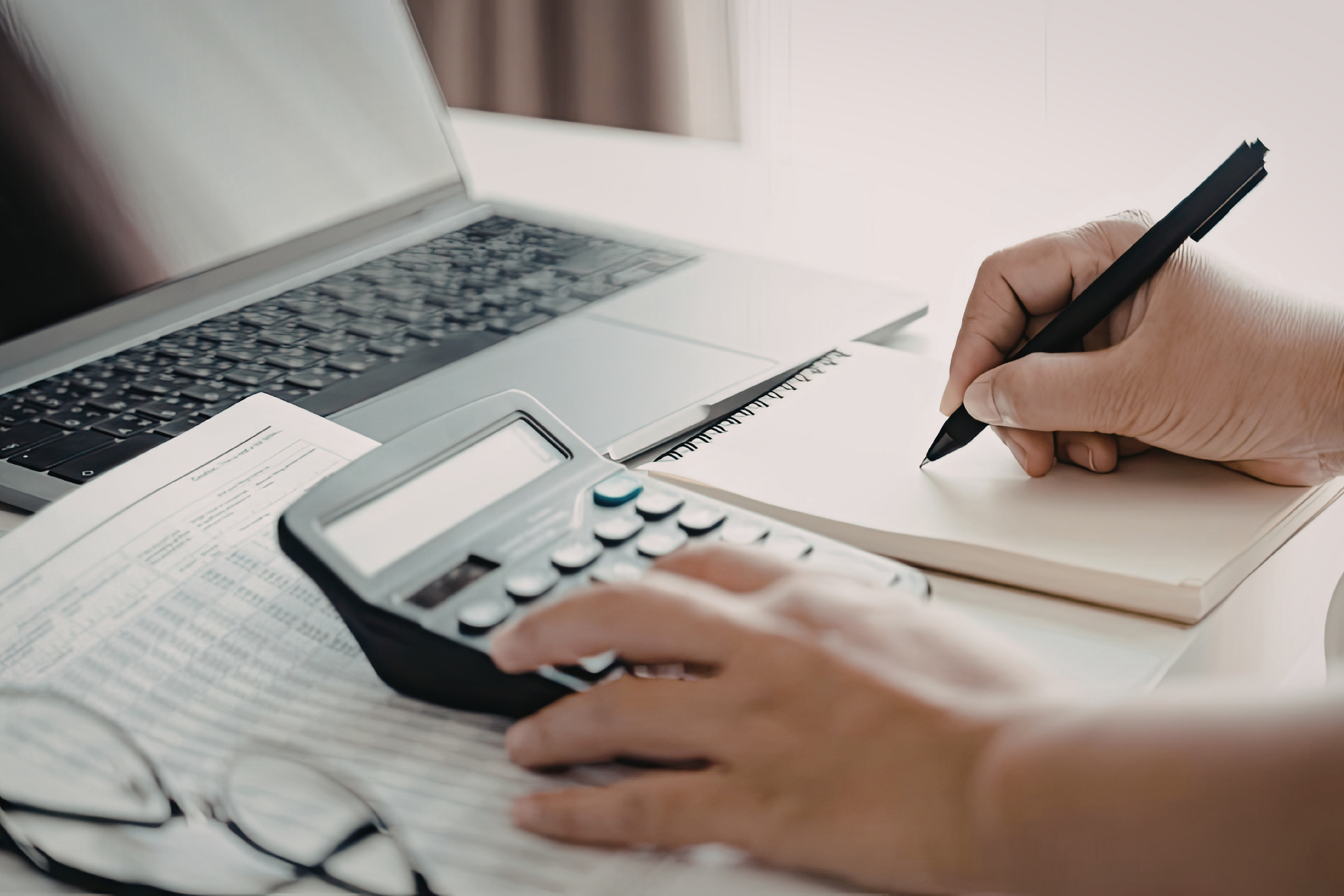Office worker using a calculator.