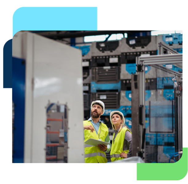 Manufacturing workers collaborating on the factory floor during production operations