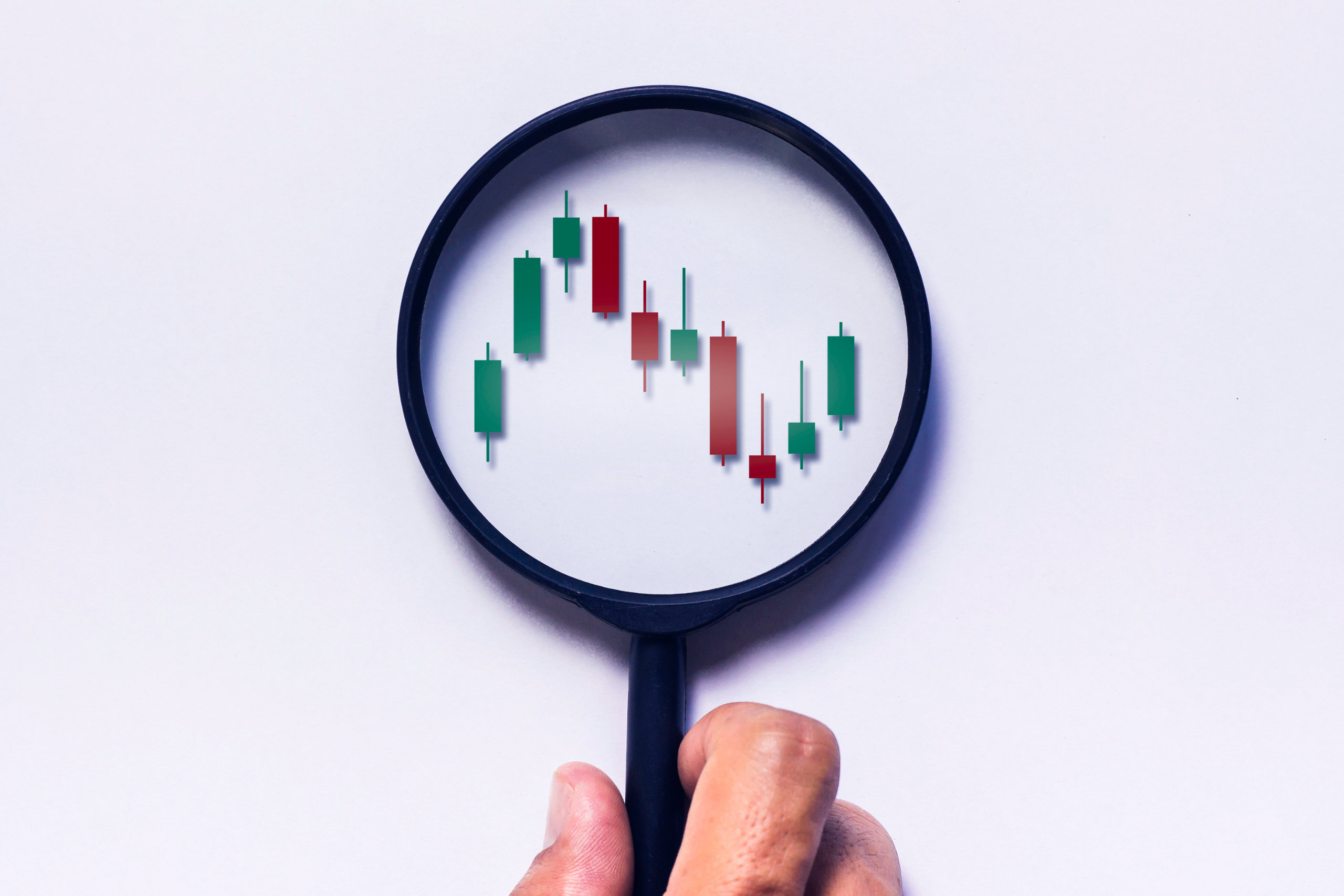 Magnifying glass highlighting trends on a chart